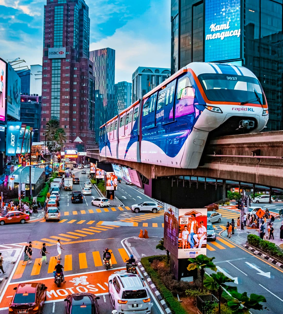 A rapidKL monorail crossing a busy street in central Kuala Lumpur